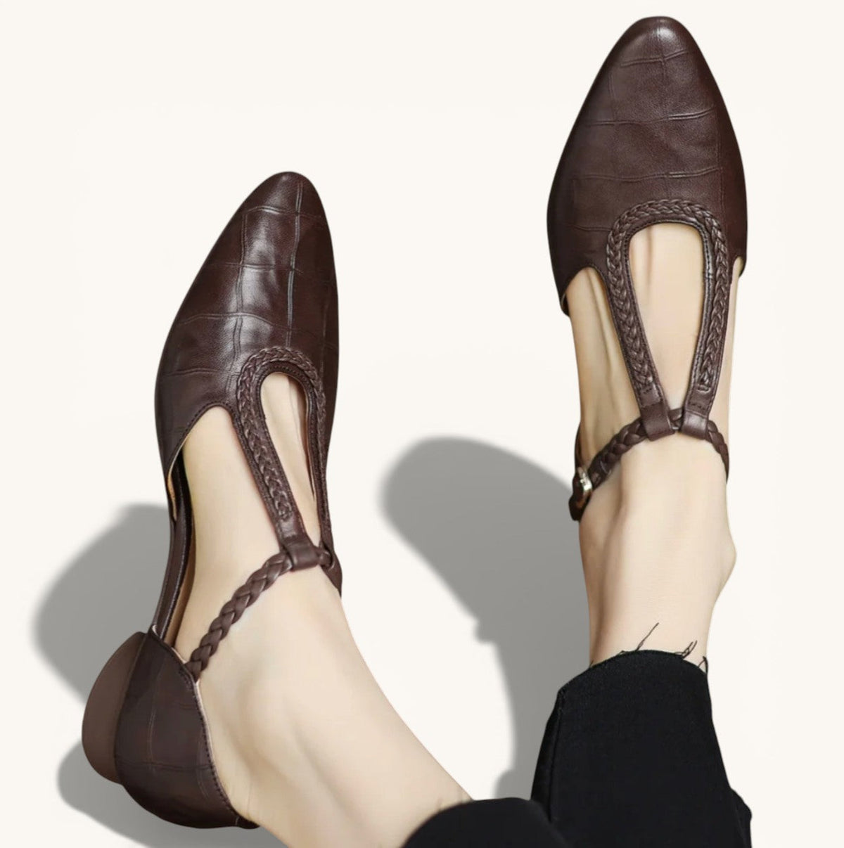 Classic Mary Jane flats shown in brown and black