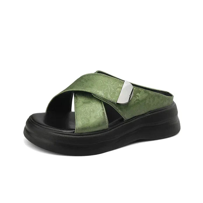 Floral textured platform sandals with wide crisscross velcro straps and elevated sole