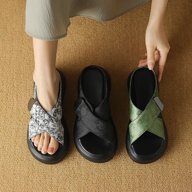 Floral textured platform sandals with wide crisscross velcro straps and elevated sole