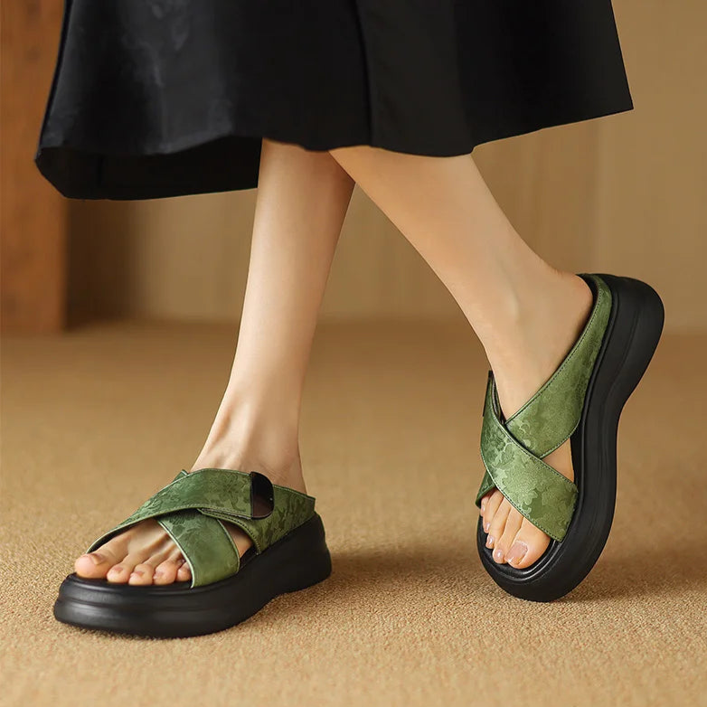 Floral textured platform sandals with wide crisscross velcro straps and elevated sole