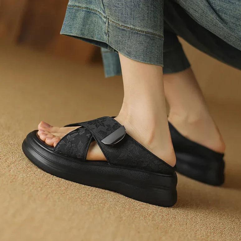 Floral textured platform sandals with wide crisscross velcro straps and elevated sole