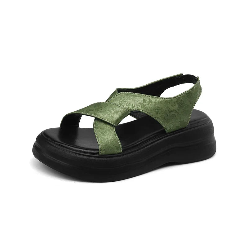Floral embossed crisscross platform sandals with chunky sole in black