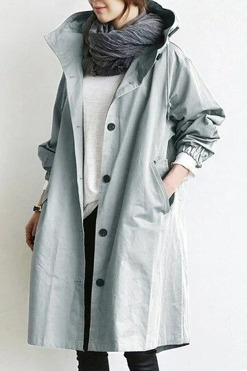 Eva tailored trench coat shown in neutral and soft colours, buttoned and belted