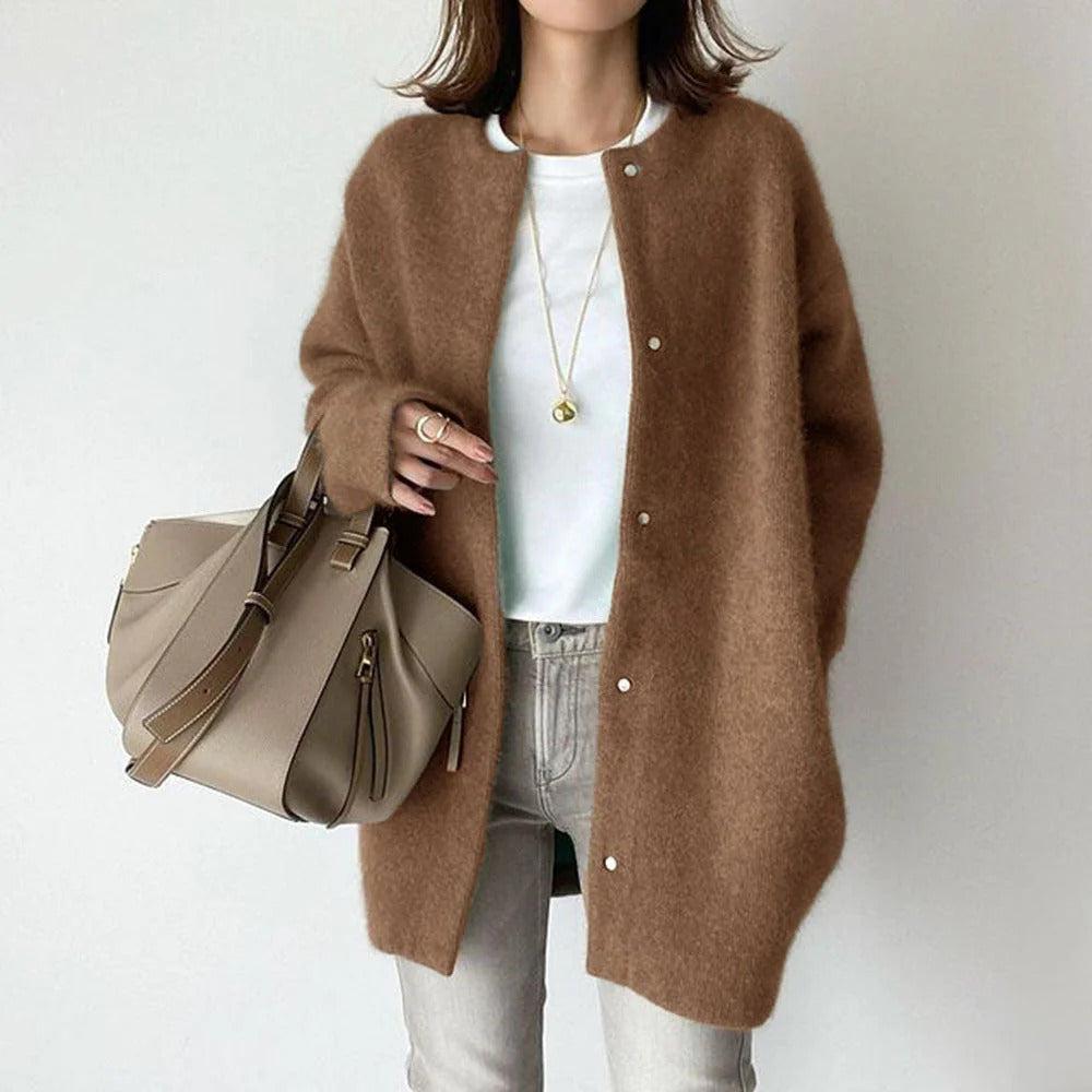 Orla relaxed fit coat shown in a neutral shade, styled for everyday wear