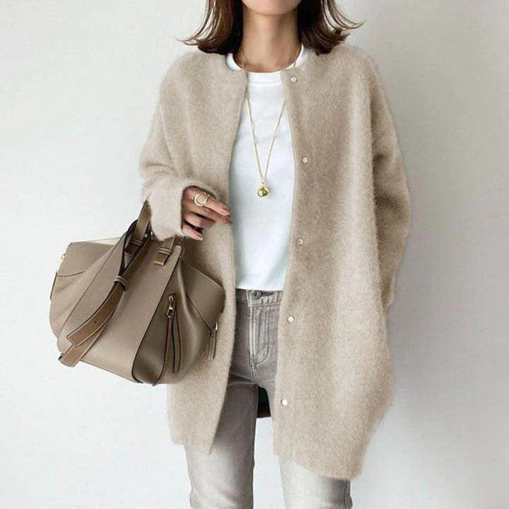 Orla relaxed fit coat shown in a neutral shade, styled for everyday wear