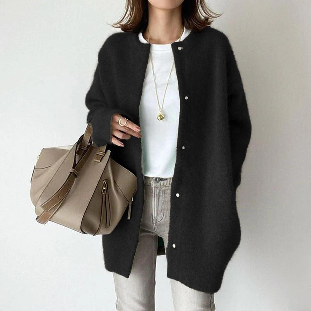 Orla relaxed fit coat shown in a neutral shade, styled for everyday wear