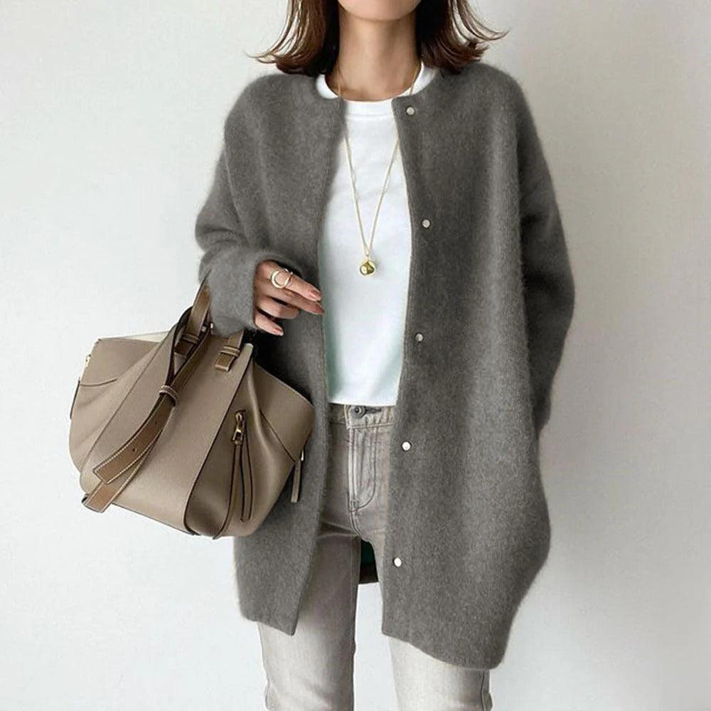 Orla relaxed fit coat shown in a neutral shade, styled for everyday wear