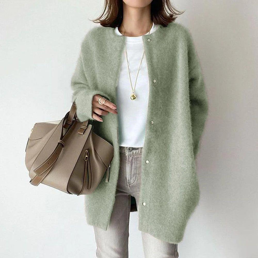 Orla relaxed fit coat shown in a neutral shade, styled for everyday wear