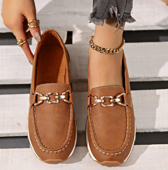 Women's buckle loafers shown in khaki, black, brown and marine blue