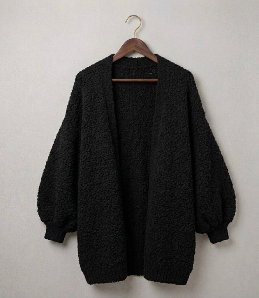 Oversized relaxed knit cardigan with dropped shoulders in a neutral colour