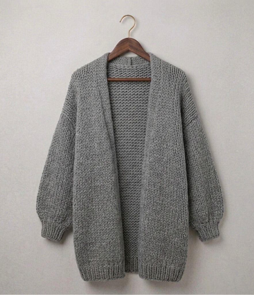 Oversized relaxed knit cardigan with dropped shoulders in a neutral colour