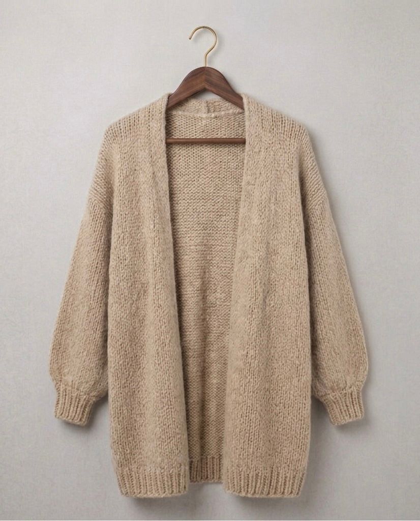 Oversized relaxed knit cardigan with dropped shoulders in a neutral colour