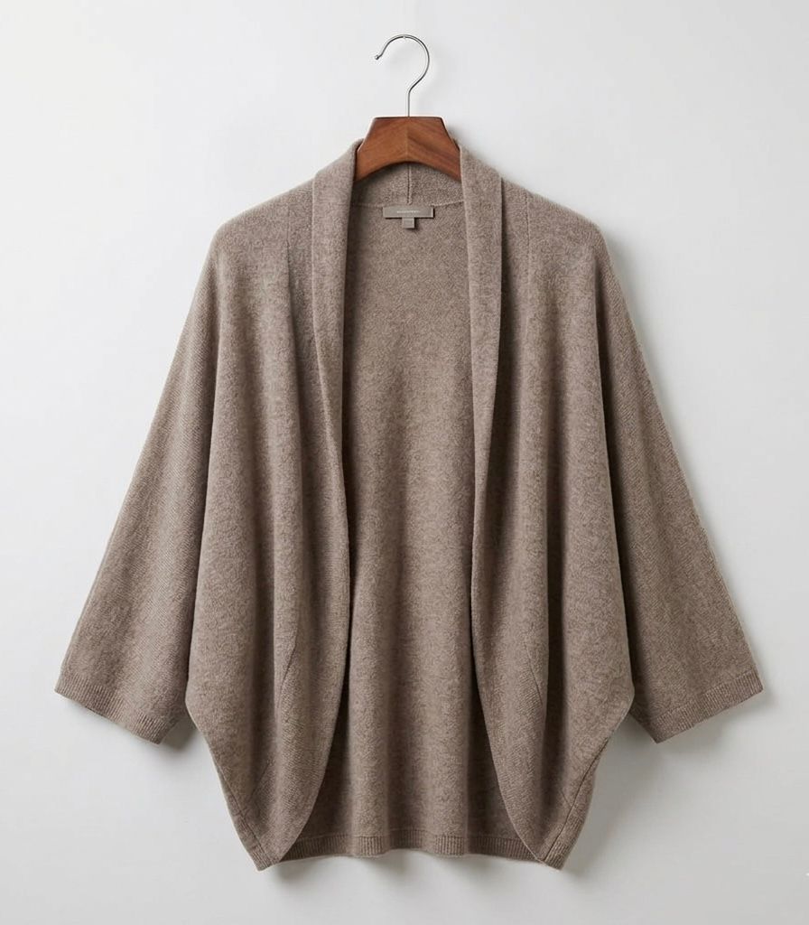 Alpina oversized Merino wool shawl draped over the shoulders in neutral tones