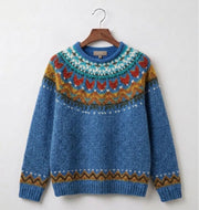 Blue vintage-inspired Nordic knit jumper with a relaxed drape and ribbed cuffs