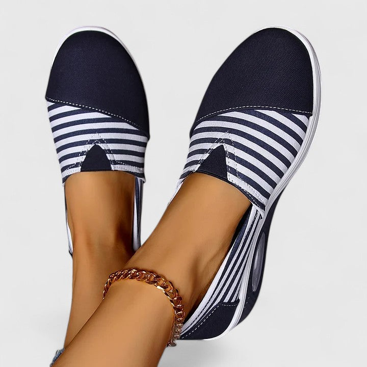 Comfortable everyday women's slip-on sneakers shown in blue, black and red