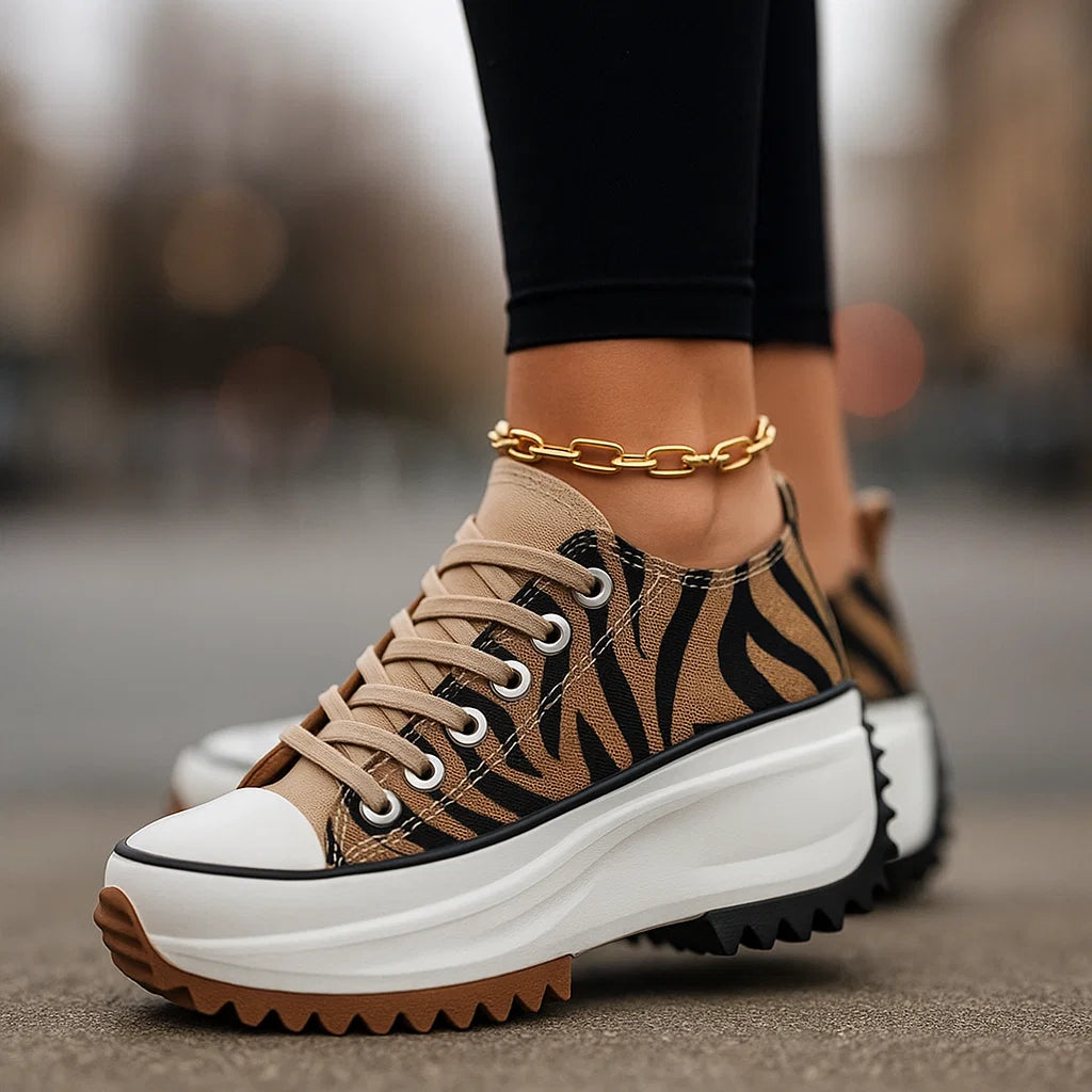 Imogen Rise platform sneakers shown in tiger print, classic black, white snow and light tan