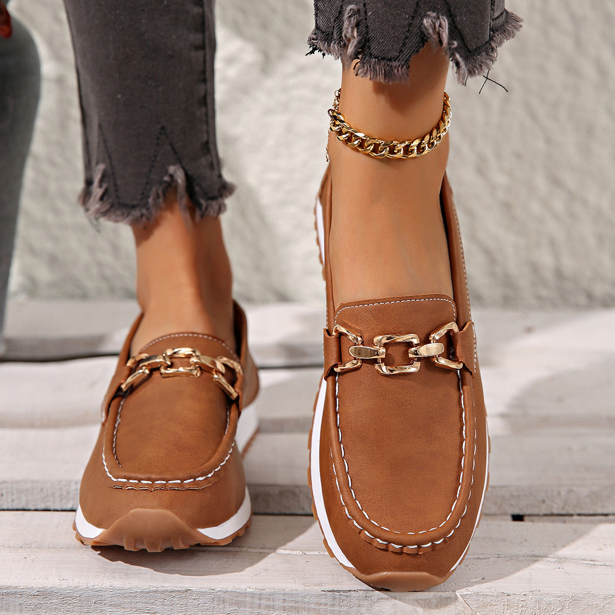 Women's buckle loafers shown in khaki, black, brown and marine blue
