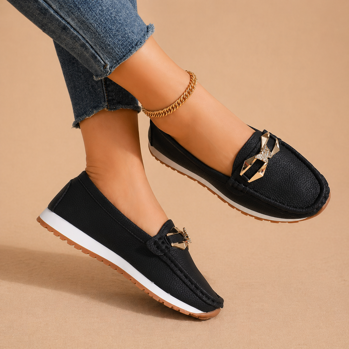 Women's buckle loafers in beige and black, classic slip-on flats