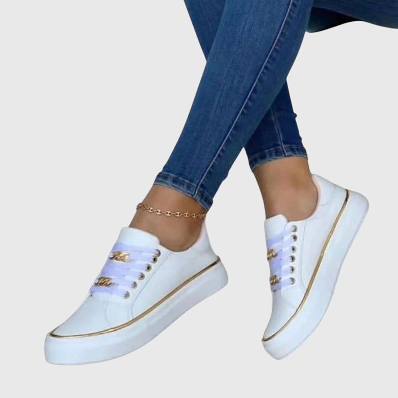 Camille slip-on everyday sneakers shown in black, white and gold
