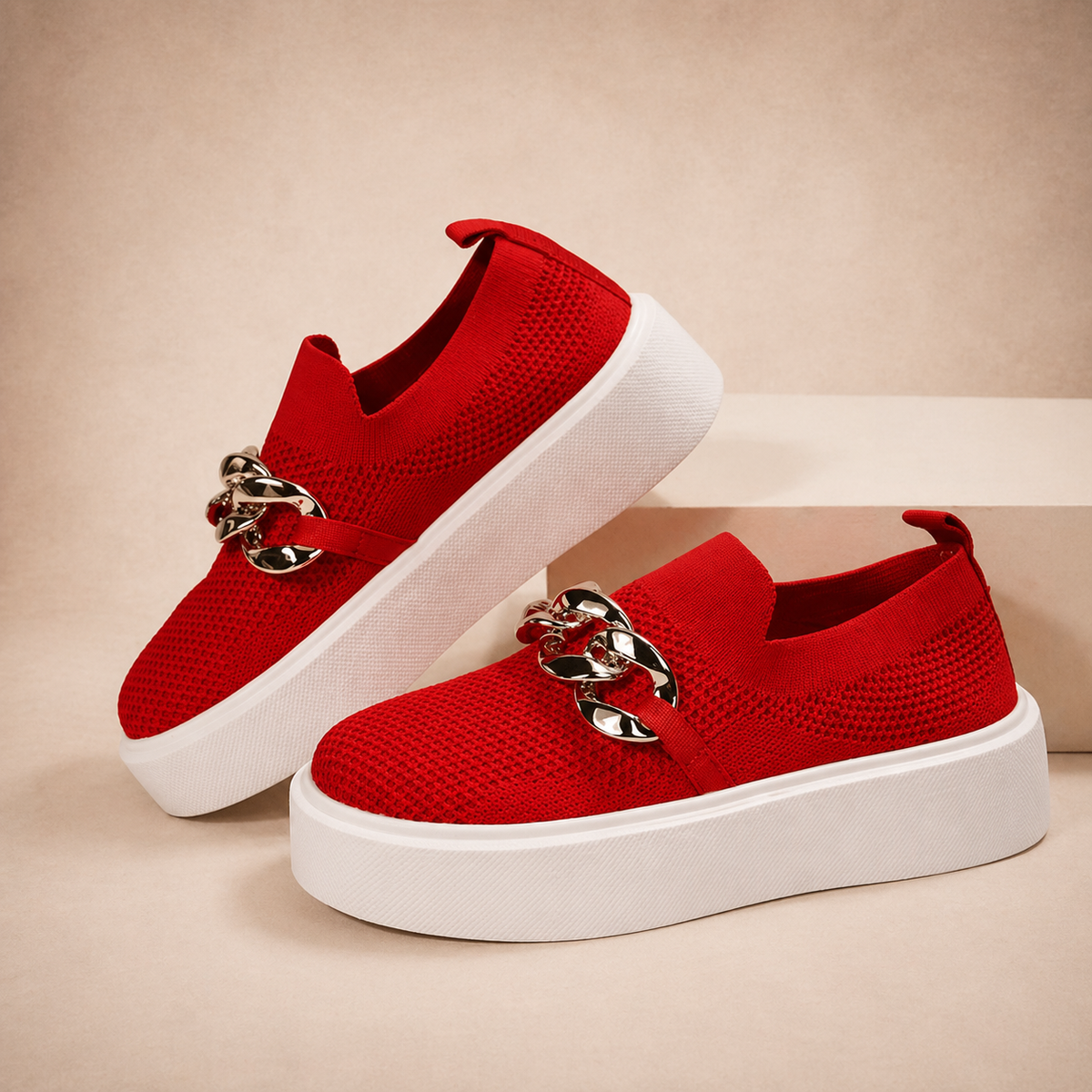 Womens chain-detail slip-on loafers shown in black, camel, white and red