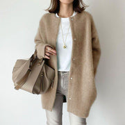 Orla relaxed fit coat shown in a neutral shade, styled for everyday wear