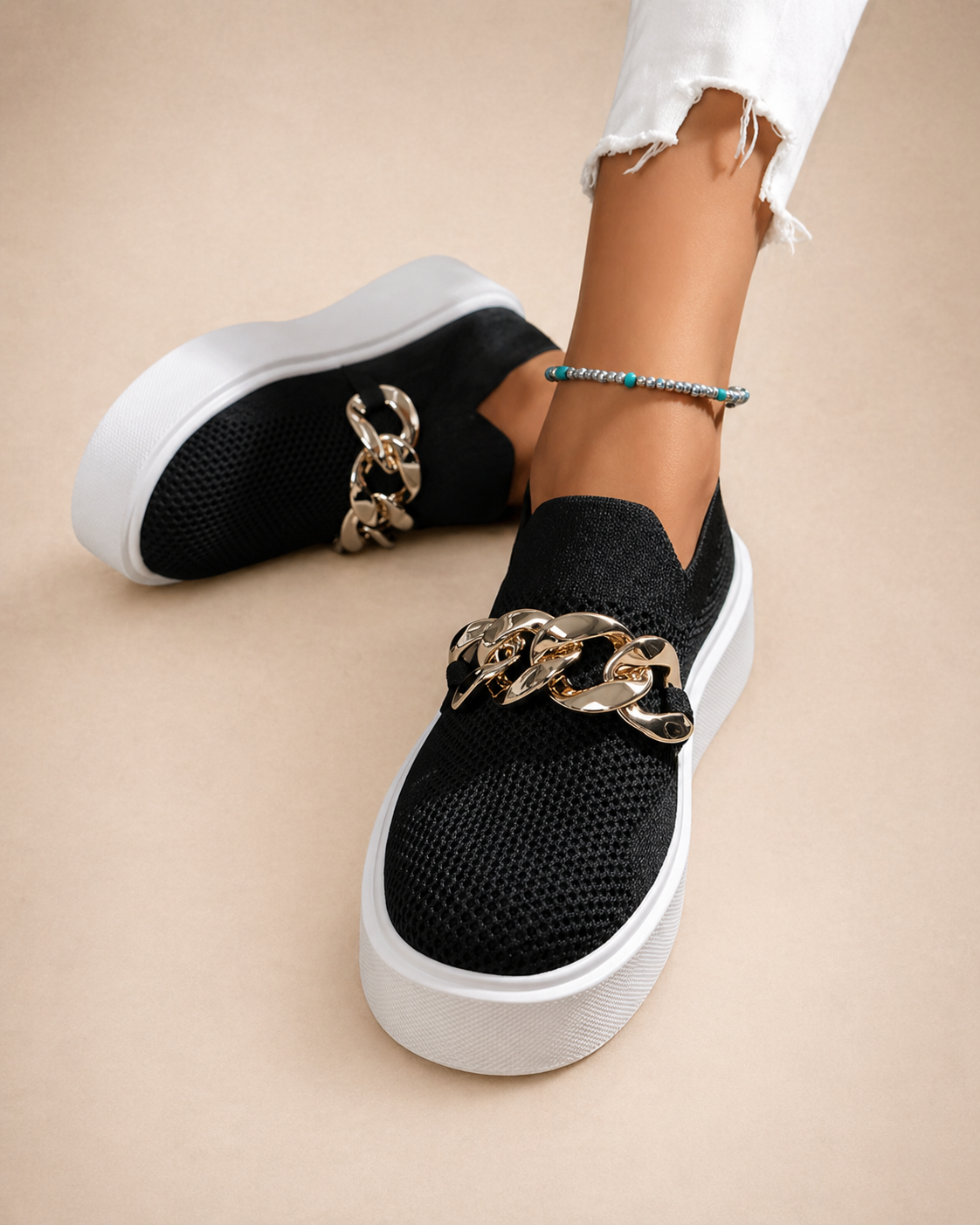 Womens chain-detail slip-on loafers shown in black, camel, white and red