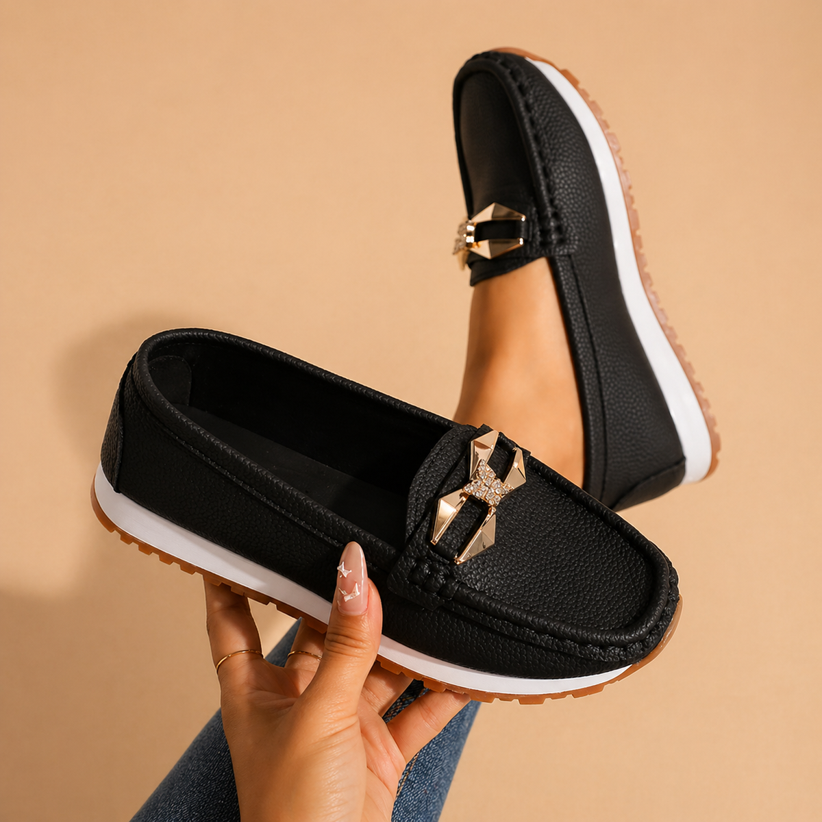 Women's buckle loafers in beige and black, classic slip-on flats