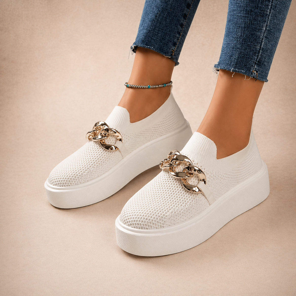 Womens chain-detail slip-on loafers shown in black, camel, white and red