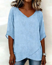 Donna irregular V-neck top shown in blue, white and navy blue