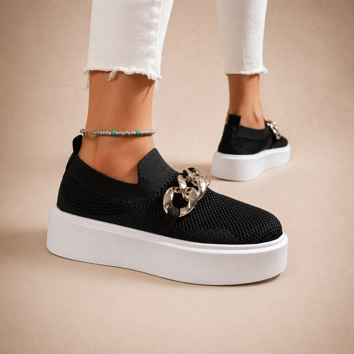Womens chain-detail slip-on loafers shown in black, camel, white and red