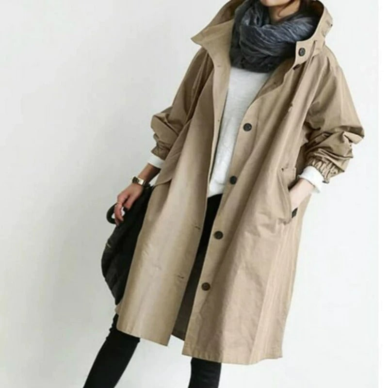 Eva tailored trench coat shown in neutral and soft colours, buttoned and belted