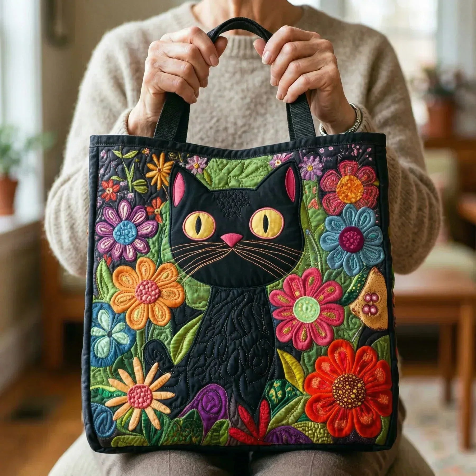 Quilted handmade bag featuring a whimsical enchanted black cat design