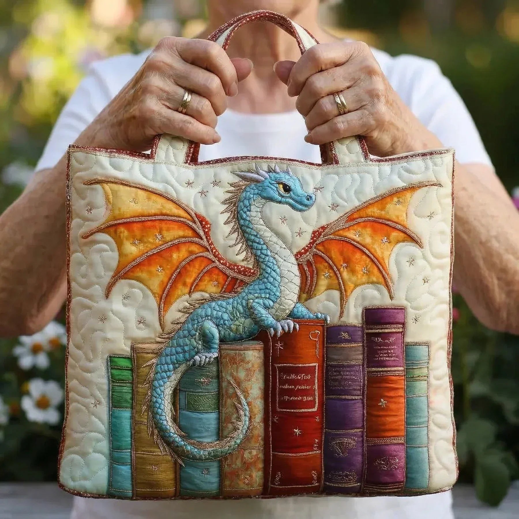 Emerald green quilted handmade bag with dragon and book-inspired design