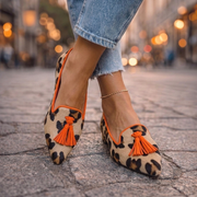 Pointed-toe tassel flats shown in leopard, zebra, plaid and solid colourways