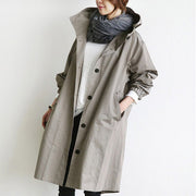 Eva tailored trench coat shown in neutral and soft colours, buttoned and belted