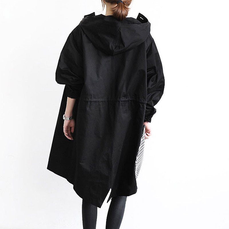 Eva tailored trench coat shown in neutral and soft colours, buttoned and belted