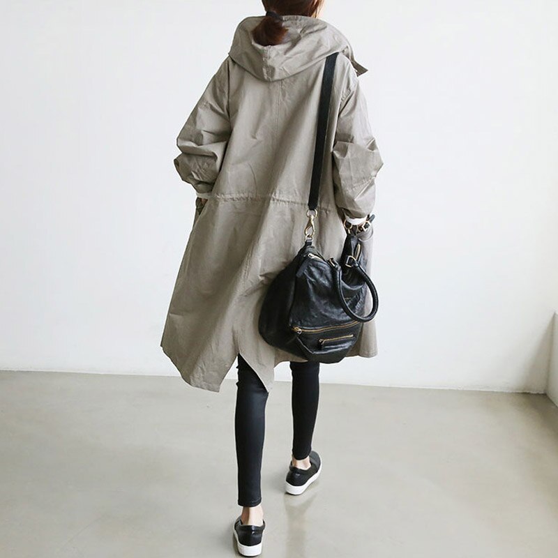 Eva tailored trench coat shown in neutral and soft colours, buttoned and belted