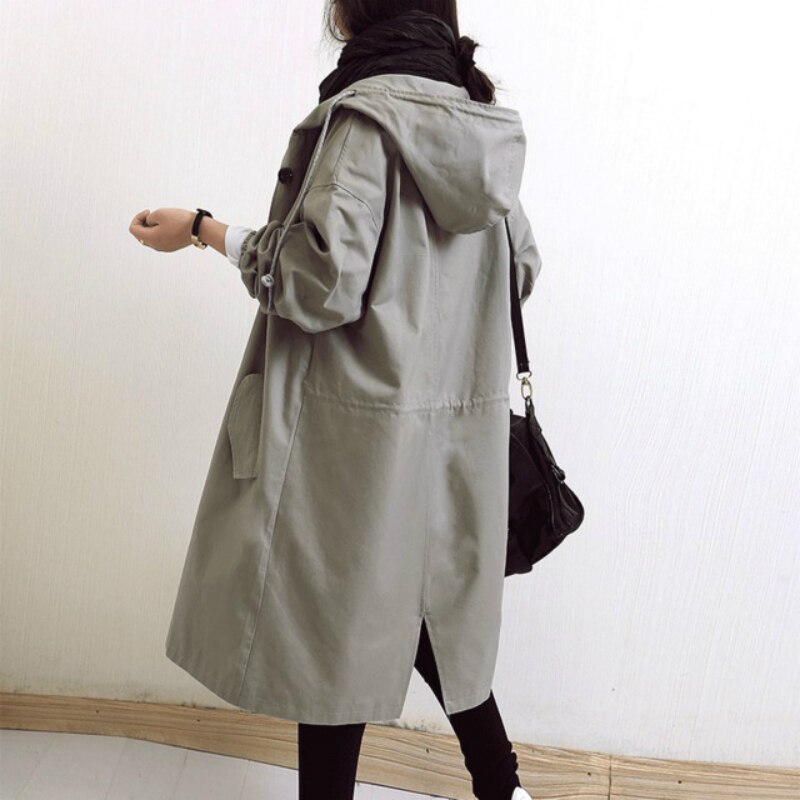 Eva tailored trench coat shown in neutral and soft colours, buttoned and belted