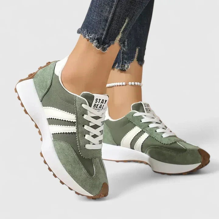 Women's everyday lace-up comfort sneakers shown in white, green, black and yellow