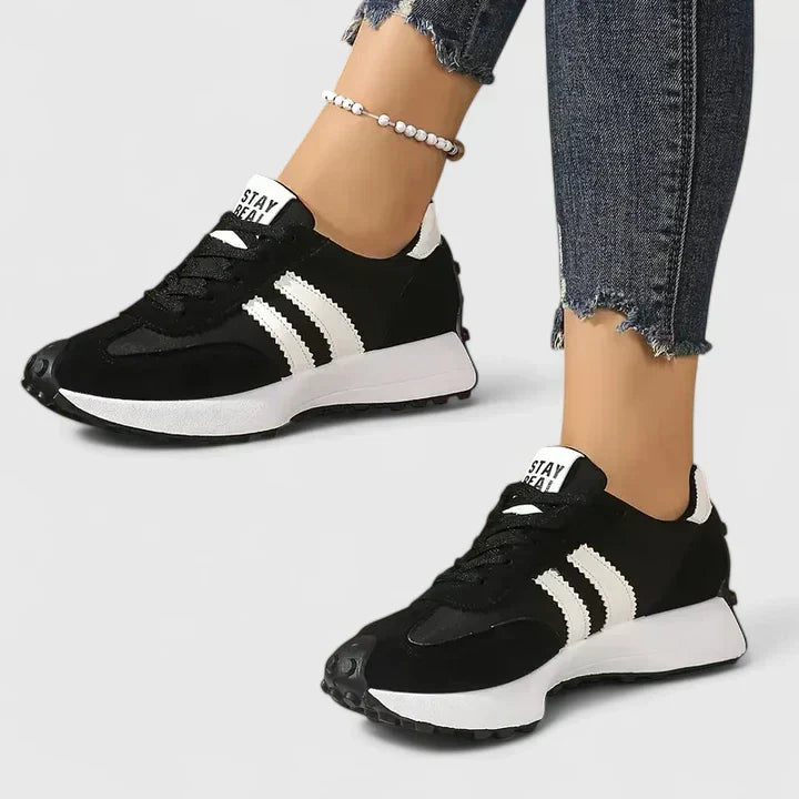 Women's everyday lace-up comfort sneakers shown in white, green, black and yellow