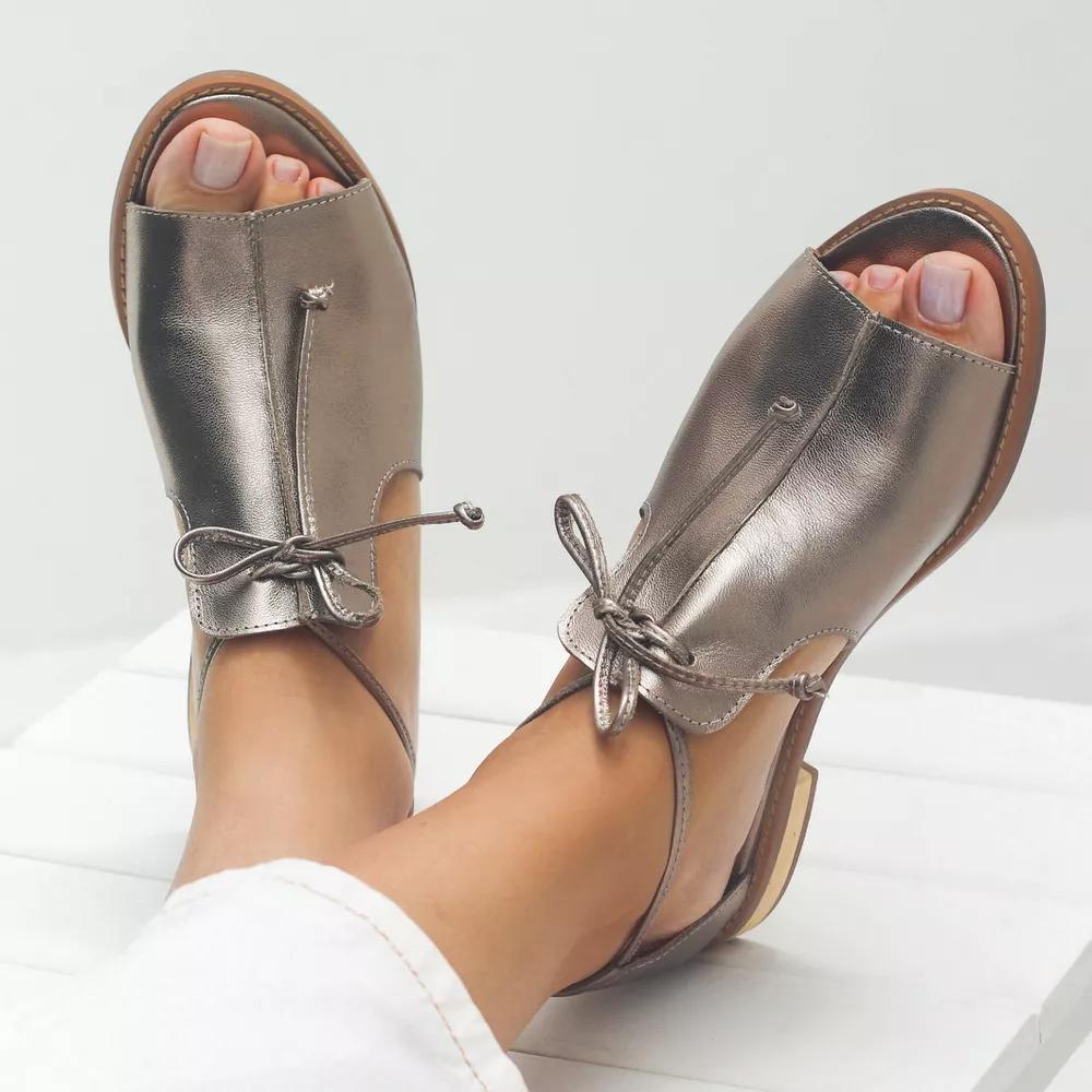 Champagne strap-style sandals for women shown from the side