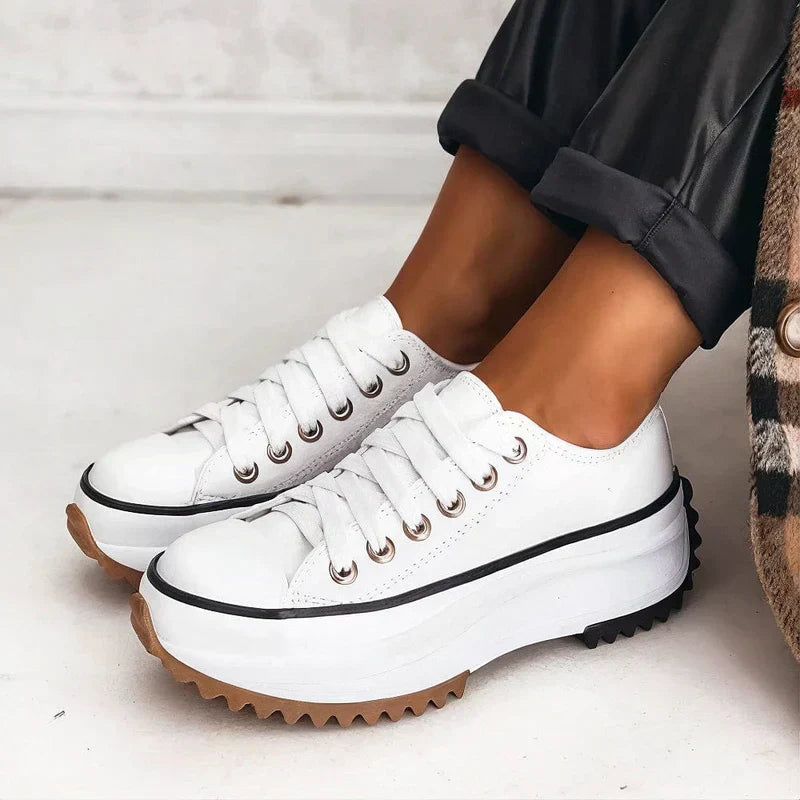 Elisa platform sneakers shown in brown, black and alpine white