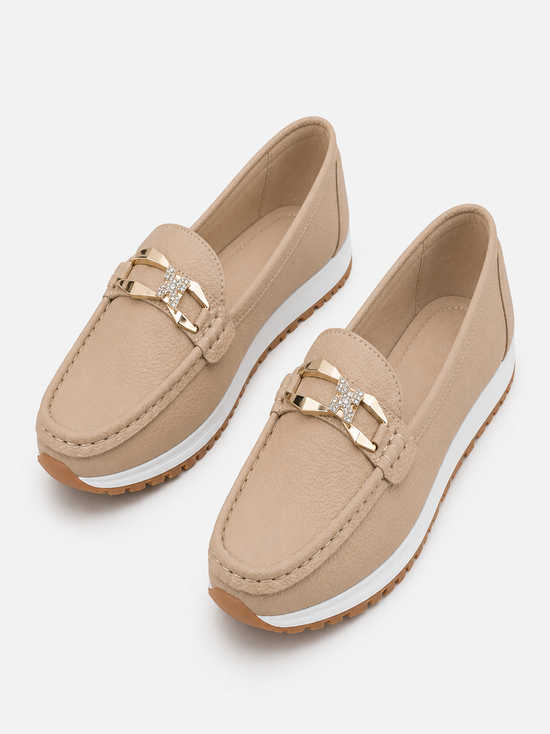Women's buckle loafers in beige and black, classic slip-on flats