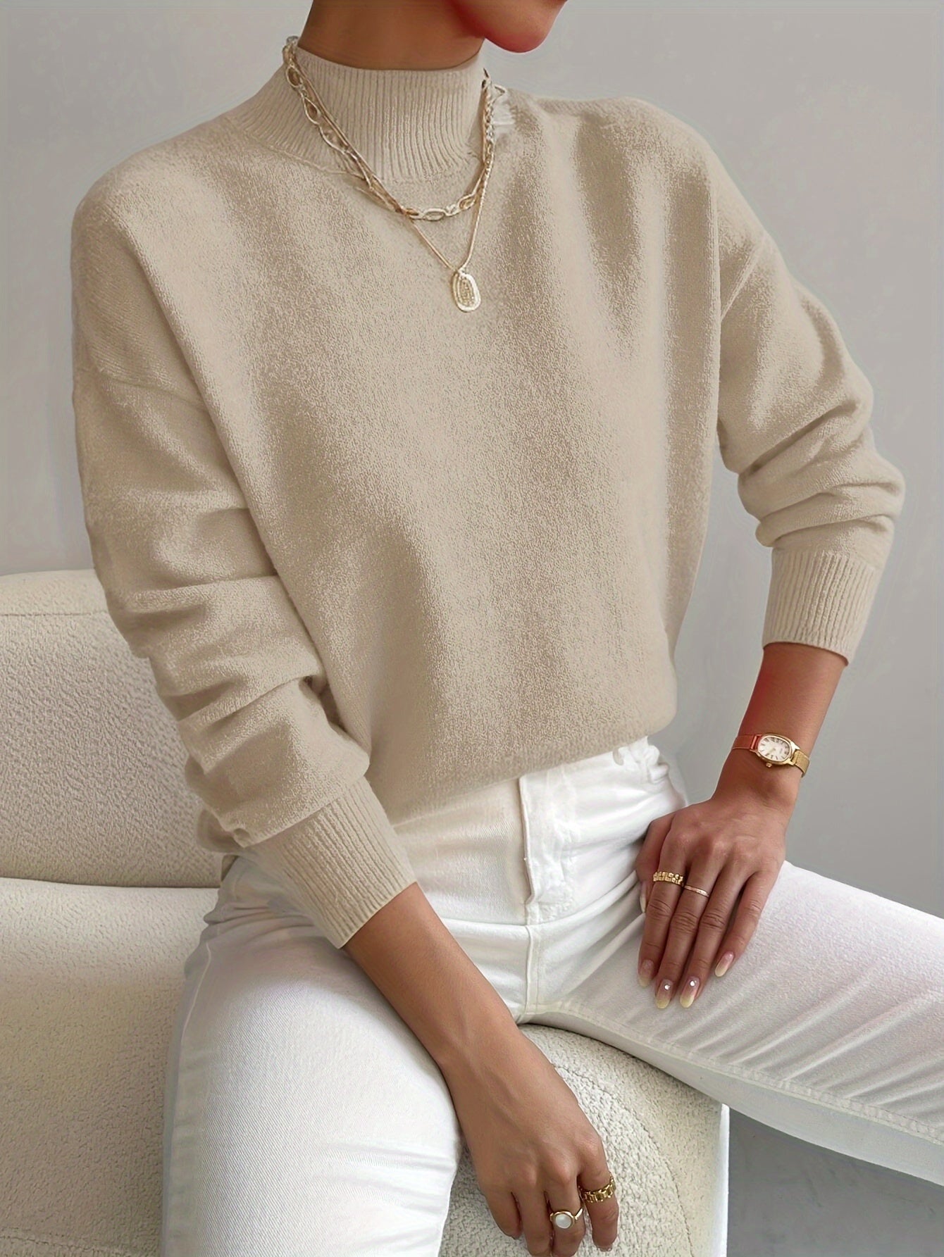 Emily elegant turtleneck knit sweater shown in soft neutral tones