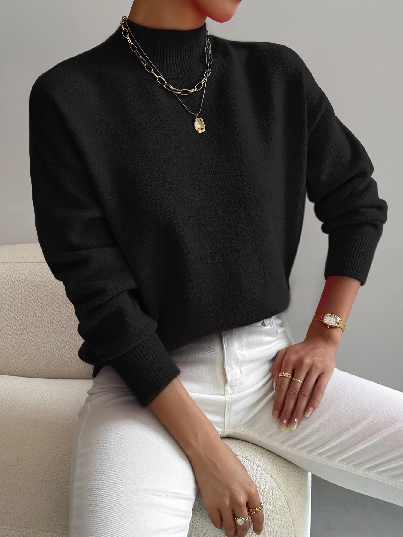 Emily elegant turtleneck knit sweater shown in soft neutral tones