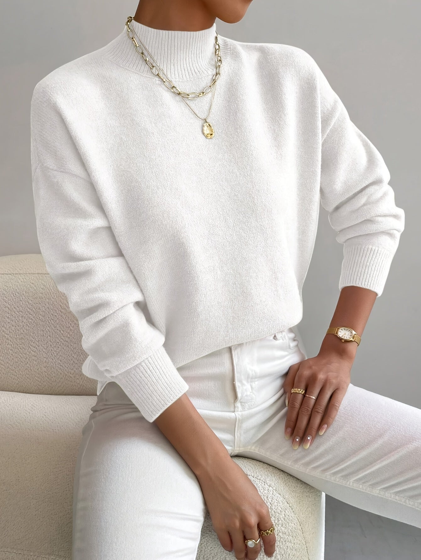 Emily elegant turtleneck knit sweater shown in soft neutral tones