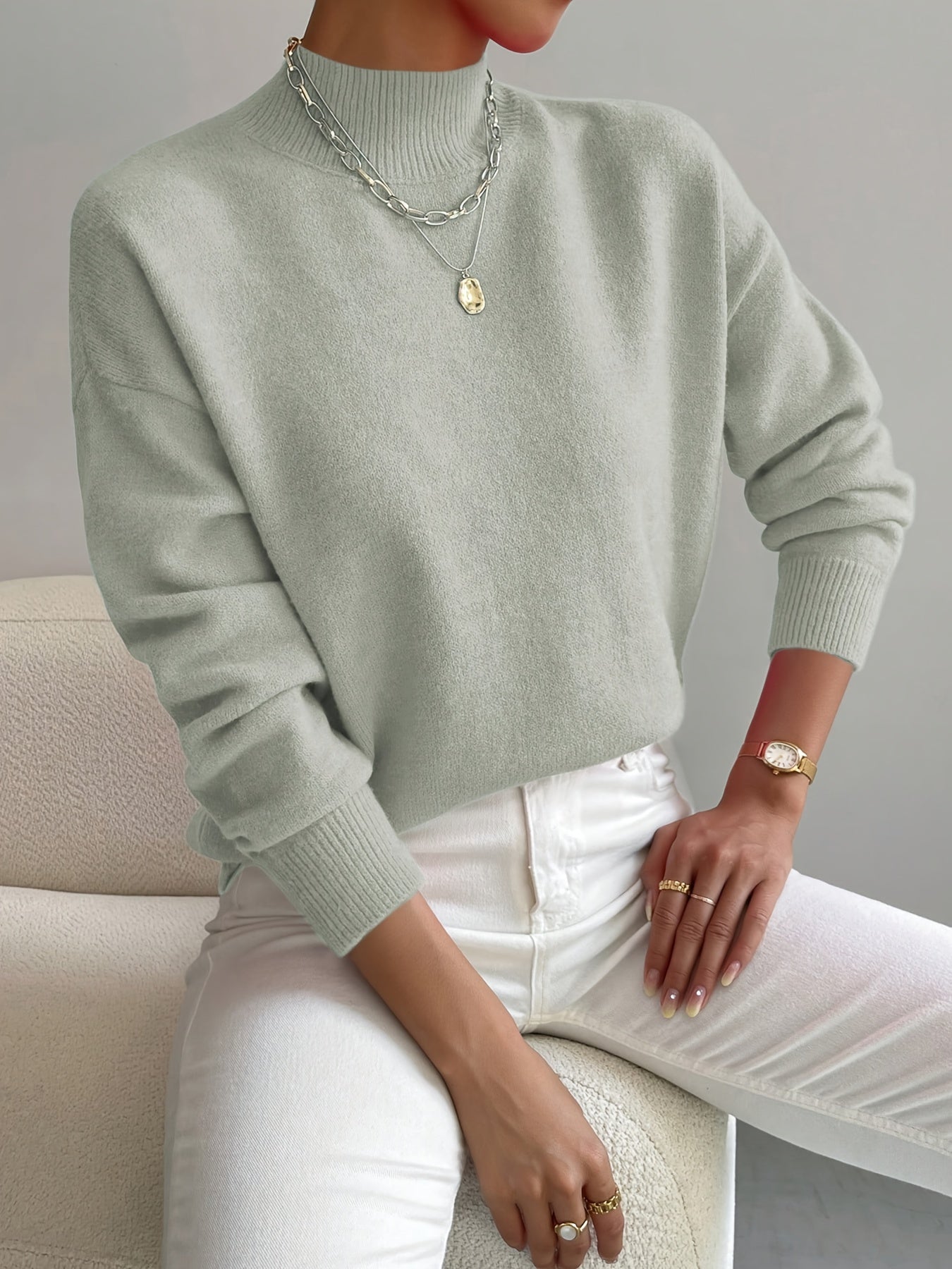 Emily elegant turtleneck knit sweater shown in soft neutral tones