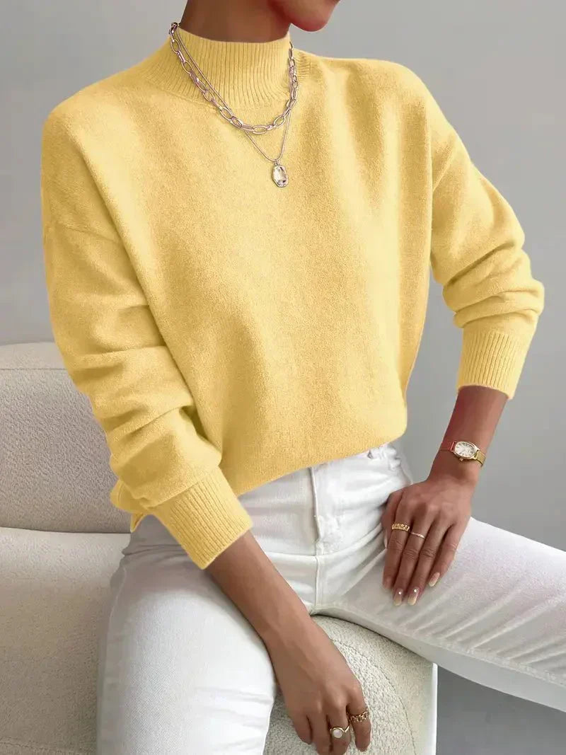 Emily elegant turtleneck knit sweater shown in soft neutral tones