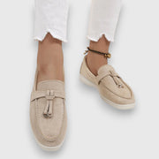 Womens slip-on loafers shown in soft neutral and pastel colour options