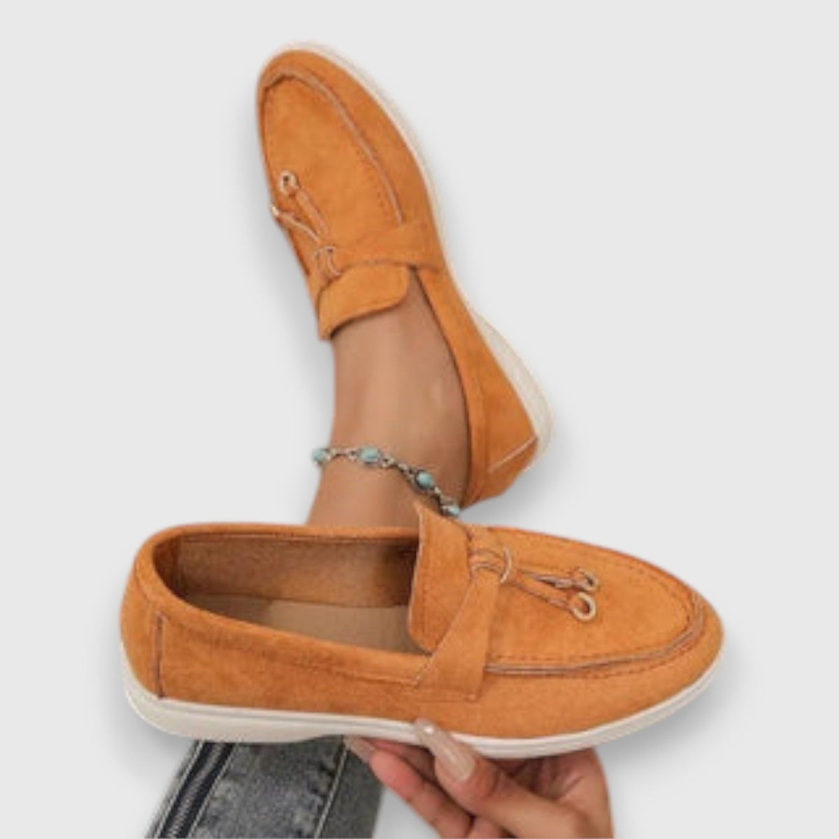 Womens slip-on loafers shown in soft neutral and pastel colour options